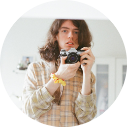 Strawberry (they/she) is a non-binary freelance photographer/videographer that works with individuals and businesses to make creative visions come to life. Having left academic studies to pursue creative work, Strawberry bring a new perspective to ideas for the future.